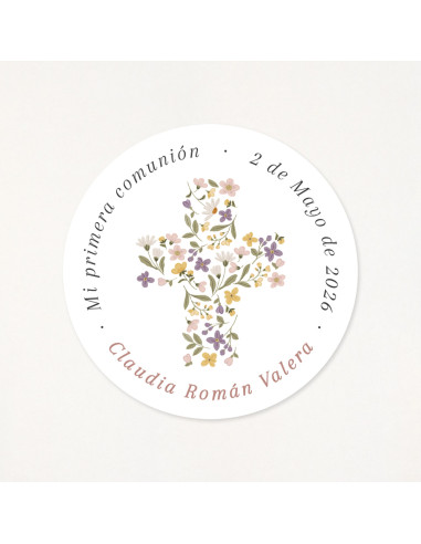 Adhesivo circular de 6cm, personalizado con los datos de su primera comunión y una cruz floral como protagonista