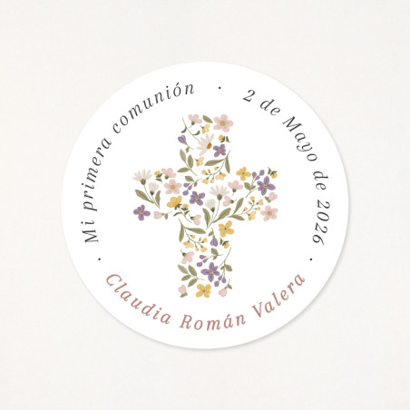 Adhesiu circular, de 6cm, personalitzat amb les dades de la seva primera comunió, i una creu floral com a protagonista